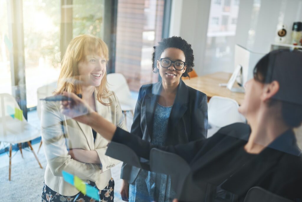 Business discussions. Shot of businesswomen brainstorming in an office.