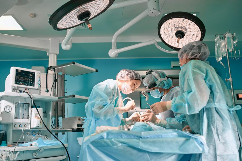 Modern surgery in a technologically advanced hospital. Bright room of intensive care. Doctors and