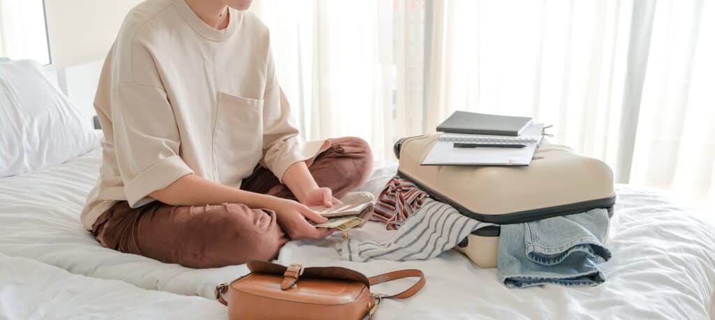 Travel.Suitcase.Girl traveler packing luggage in suitcase Travel,tourism,vacation,relocation.Mental