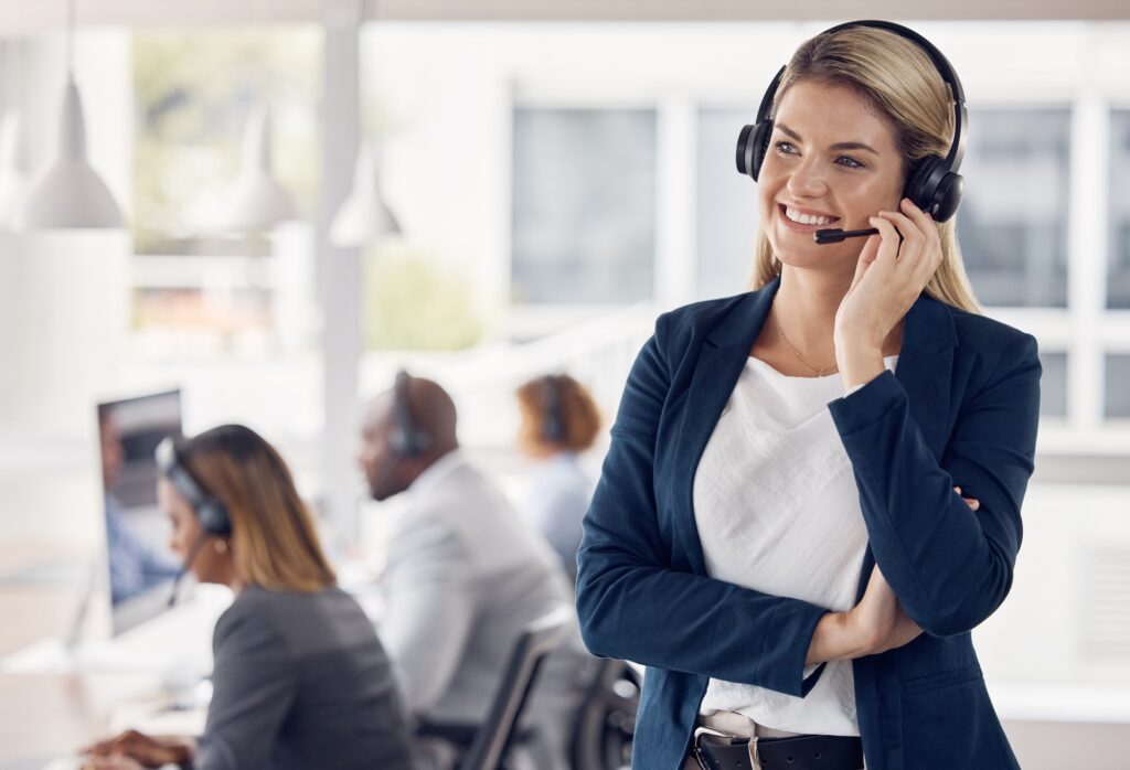 Woman, call center and smile in leadership with headset for telemarketing, customer service or supp