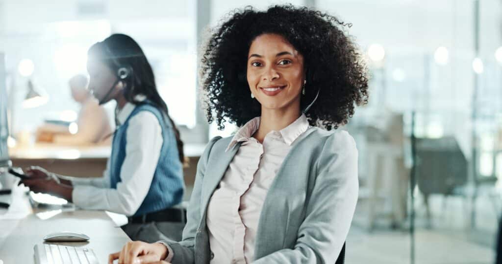 Happy woman, portrait and tech in call center for customer service, telemarketing and pride in offi